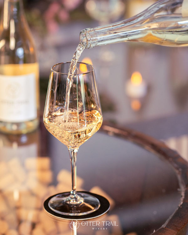 Pouring white wine into a glass