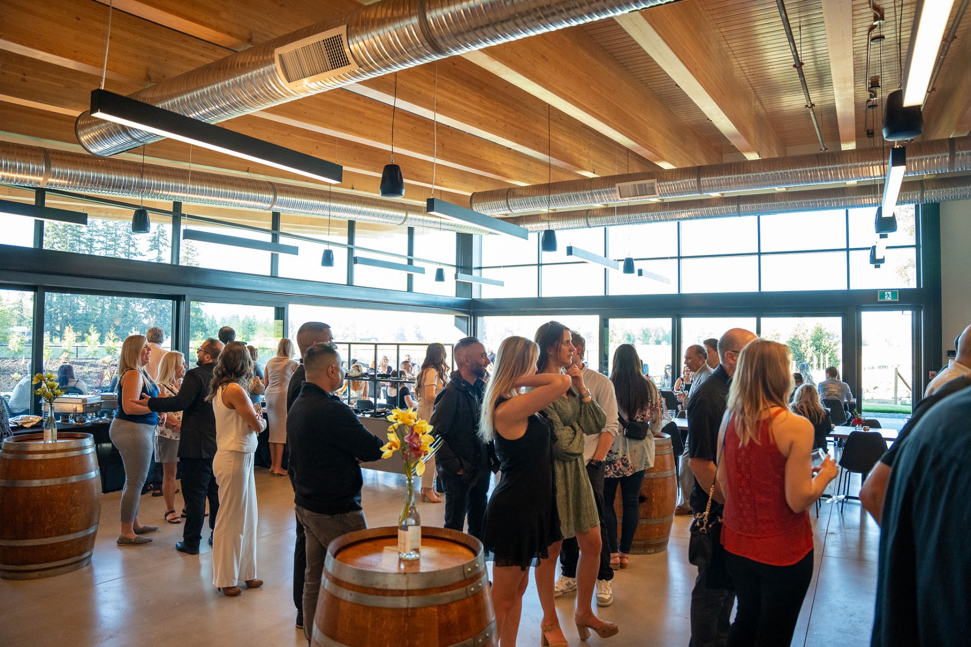 Cocktail reception in the floor-to-ceiling glass tasting room