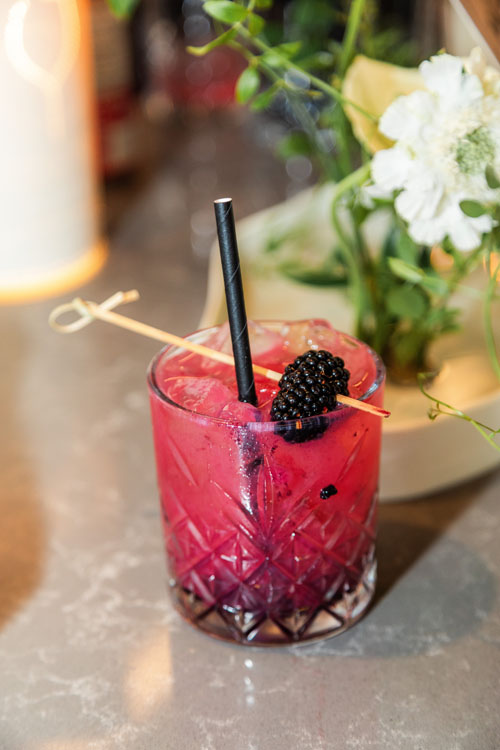 Berry cocktail with blackberry garnish